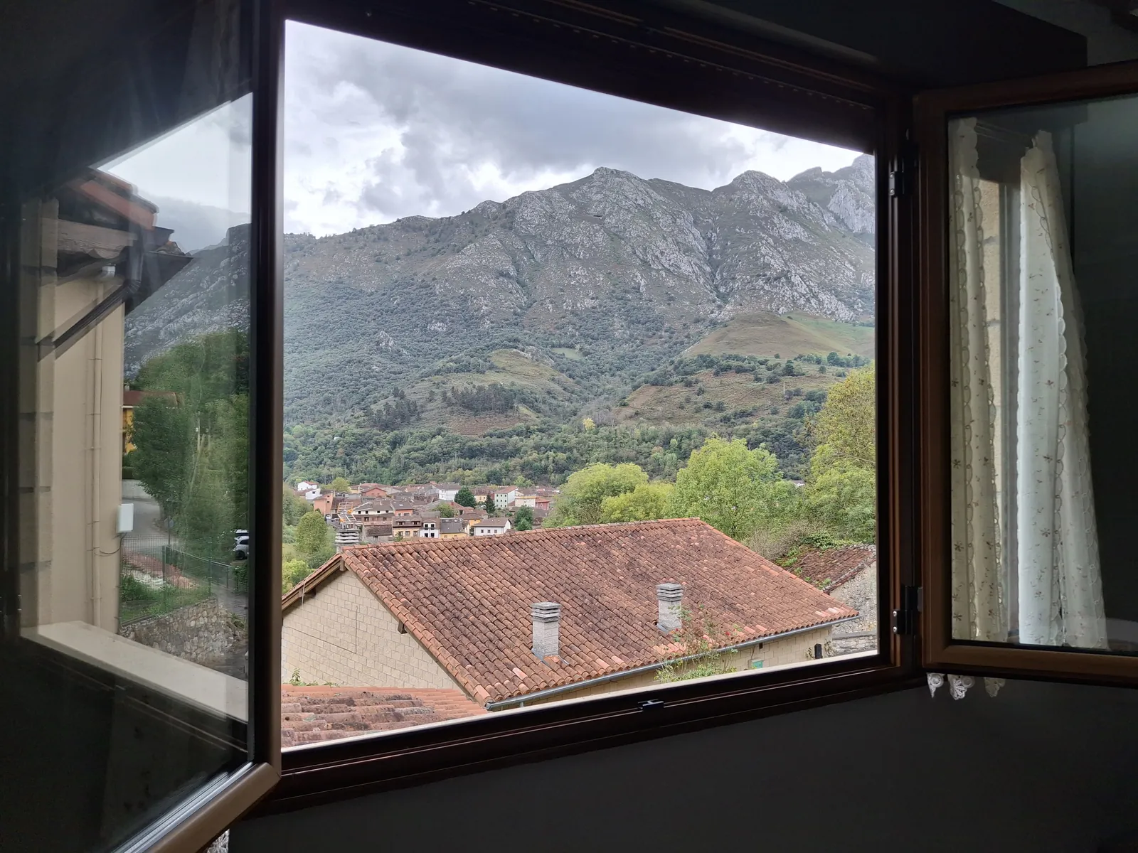 Open window in the Cares apartment, looking out over the valley and the mountains